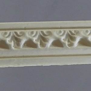 May include: A white decorative moulding with a repeating pattern of stylised leaves. The moulding is made of a lightweight material and has a smooth, slightly textured surface.