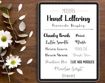 May include: A digital art print featuring a black tablet displaying a list of hand lettering Procreate brushes. The text includes "Chunky Brush," "Extra Smooth," and "Brush Coarse." The background is a dark wood surface with white flowers and leaves.