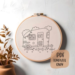 May include: A black and white line drawing of a camper van with a surfboard on top, surrounded by clouds and grass. The image is on a beige fabric background and is in a wooden embroidery hoop. The text "PDF TEMPLATE ONLY" is in a brown rectangle at the bottom of the image.