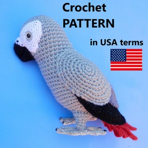 May include: Crochet pattern for a grey parrot amigurumi toy, written in US terms. The parrot is sitting on a blue background. The pattern includes instructions for crocheting the body, head, beak, eyes, and feet.