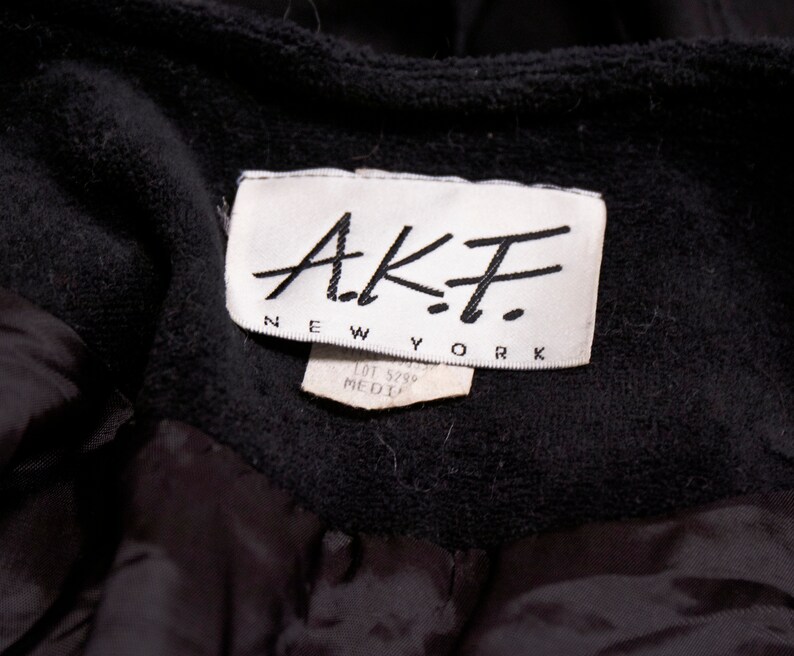 Vintage 80s black quilted draped puffer jacket