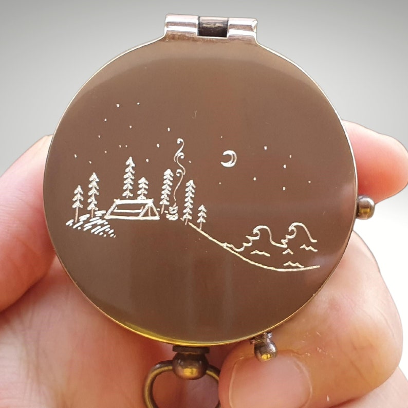 camp design engraved compass