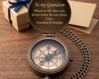 May include: A bronze-toned metal pocket compass with a hinged lid featuring the engraved text: To my Grandson, Wherever life takes you, always know the way home. Love, Grandma & Grandpa. The compass includes a matching metal chain.
