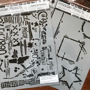 May include: Two 9x12 inch laser cut stencils. The first stencil features a variety of abstract shapes, lines, and text including "PROOF", "CONTENT", and "person". The second stencil features a star, a square, and a circle with a cross inside.