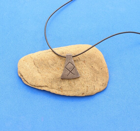 Items similar to Axe Amulet with Rune on Etsy