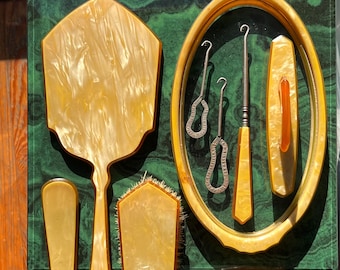 Nine Piece Art Deco Vanity Set With Tray, Hand Mirror, Brush, Storage Jar, Shoe Horn, Nail Buffer, And Boot Botton Hooks