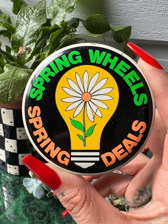 Large Vintage Blacklight Reactive Flower In Lightbulb Button "Spring Wheels Spring Deals"