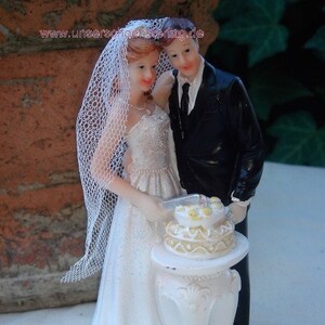 Torta superiore nozze sposa e lo sposo non convenzionale TA0119