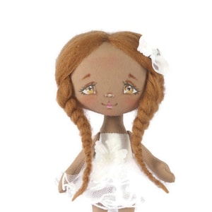 Miniature doll in white