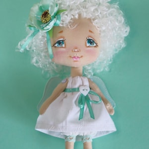 Miniature handmade cloth art doll