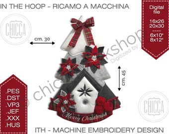May include: A Christmas tree-shaped machine embroidery design, approximately 12 inches wide and 18 inches tall. The design features a white, gray, and black tree with red plaid accents, poinsettias, and a "Merry Christmas" banner. Includes digital file formats.