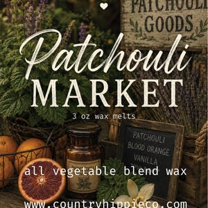 May include: A 3 oz wax melt product labeled Patchouli Market by Country Hippie Co. The display includes a brown glass jar, fresh blood orange slices, green leaves, and a small chalkboard listing patchouli, blood orange, and vanilla scents.