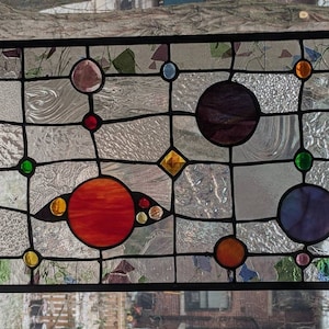 colourful, orbital, whimsical,  stained glass transom
