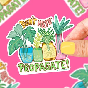 May include: Don't Hate, Propagate! Sticker featuring a colorful illustration of four potted plants with roots showing. The plants are in different colored pots and have different types of leaves. The text is in a bright green color.