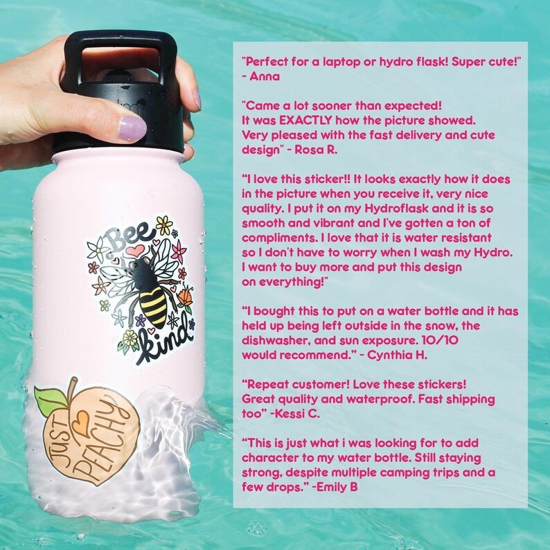 May include: Pink water bottle with a bee and "Bee Kind" design. The bottle has a peach sticker with the text "Just Peachy" and a black lid with a carrying handle. The bottle is floating in a pool of water.