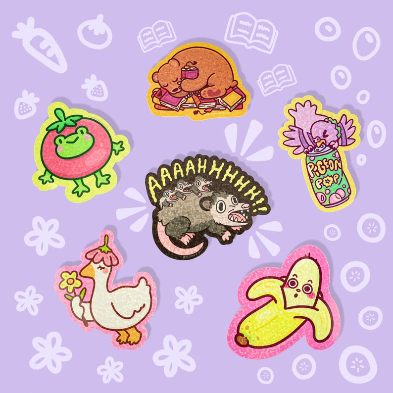 May include: A collection of colorful, cartoon-style stickers featuring various whimsical designs. Includes a sleeping bear on books, a tomato with a frog face, a possum with the text "AAAAHHHH!!!", a bird with a soda can, a goose with a flower, and a banana.