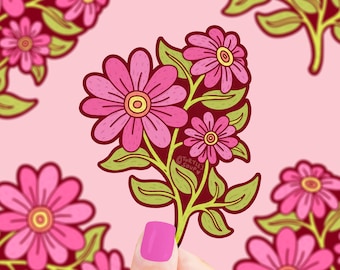 May include: A sticker featuring a bouquet of pink flowers with yellow centres and green leaves. The flowers are drawn in a cartoon style and have a retro aesthetic. The sticker is held by a hand against a pink background.