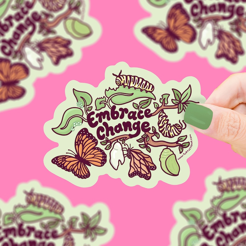 May include: A sticker with a green branch, butterflies, caterpillars, and cocoons. The text "Embrace Change" is written in a whimsical font.