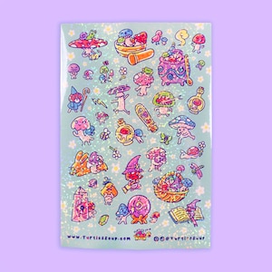 May include: A sticker sheet with a light blue background and a pattern of small white flowers. The sheet features various cartoon mushroom characters, potions, crystals, and other whimsical elements. The text "www.turtlessoup.com" is visible at the bottom.