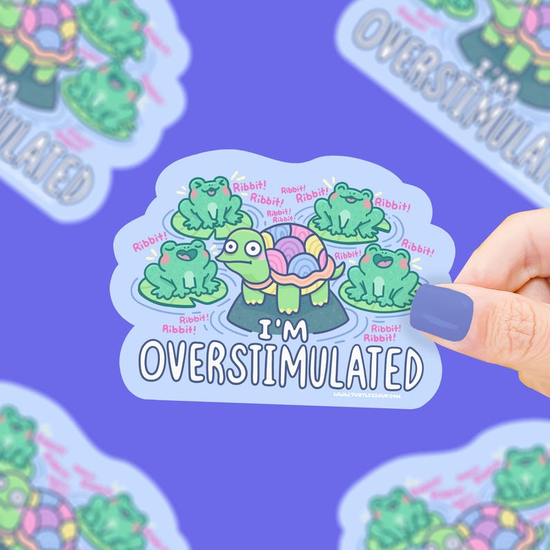 May include: A sticker with a cartoon turtle surrounded by green frogs on lily pads. The turtle has a colorful shell and the text "I'M OVERSTIMULATED". The frogs say "Ribbit!"