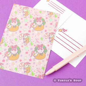 May include: Pink postcard with a repeating pattern of sloths wearing Santa hats and holding candy canes and wreaths. The postcard has a blank space for writing a message and the words "Send to:" printed on the back.
