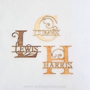 May include: Three wooden letters, L, C, and H, with decorative swirls and a horizontal bar across the middle. The letters are painted in a light wood color and have the names "Lewis", "Combs", and "Harris" written on the bars.