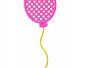 May include: A pink balloon with white polka dots and a yellow string.