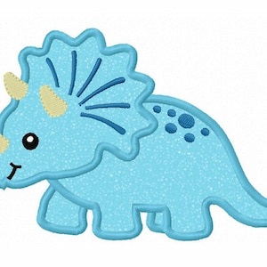 May include: A light blue cartoon triceratops with a yellow horn and blue spots. The dinosaur has a friendly face and is standing on a white background.