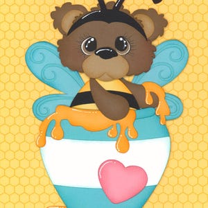 May include: A whimsical illustration of a bear dressed as a bee, holding a pot of honey. The bear is brown with a black and yellow striped body, blue wings, and a black headband. The honey pot is white with blue stripes and a pink heart.