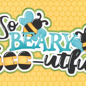 May include: A colorful graphic with the words "So BEARY BEE-utiful" in a playful font, featuring cartoon bees and a honeycomb background. The bees are black and yellow, with blue wings.