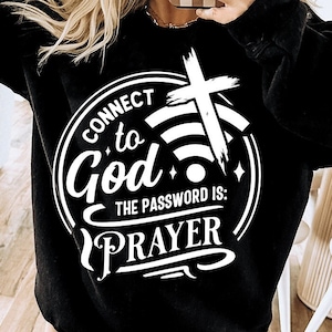 May include: Black sweatshirt with a white graphic design that says "Connect to God, the password is: Prayer". The graphic includes a cross and a wifi symbol.