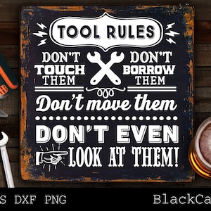 May include: A black and white sign with the text "TOOL RULES" and a set of rules for tools. The rules are: "Don't touch them", "Don't borrow them", "Don't move them", "Don't even look at them!"