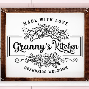 May include: Black and white sign with the text "Made with Love Granny's Kitchen Grandkids Welcome" with floral designs above and below the text.