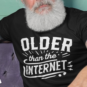 May include: A black t-shirt with white text that reads "OLDER than the INTERNET".