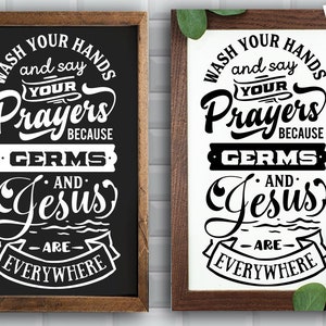 May include: Two black framed signs with white text that reads "Wash your hands and say your prayers because germs and Jesus are everywhere".