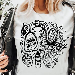 May include: Black and white graphic design featuring a stylized ribcage with a stethoscope and a floral arrangement of sunflowers and roses.