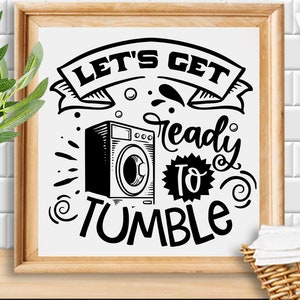 May include: Black and white illustration of a washing machine with the text "Let's Get Ready To Tumble".