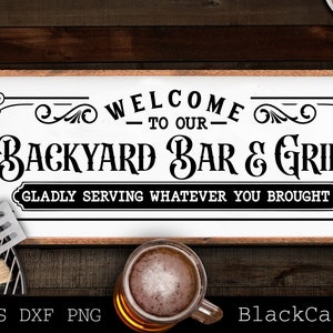 May include: A rectangular wooden sign with the text "WELCOME TO OUR BACKYARD BAR & GRILL" in black. The sign also includes the phrase "GLADLY SERVING WHATEVER YOU BROUGHT". The sign is surrounded by decorative flourishes. A glass of beer is in the foreground.