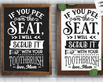 May include: Two black framed signs with white text that reads "If you pee on the seat, I will scrub it with your toothbrush - love, Mom".