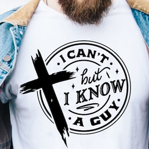 May include: A white t-shirt with a black circle design featuring a cross and the text "I CAN'T. but I KNOW A GUY."