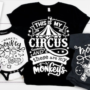 May include: Three black t-shirts with white text and graphics. The largest shirt says "This is my circus and these are my monkeys". The two smaller shirts say "Mama's Monkey" and feature a monkey graphic.