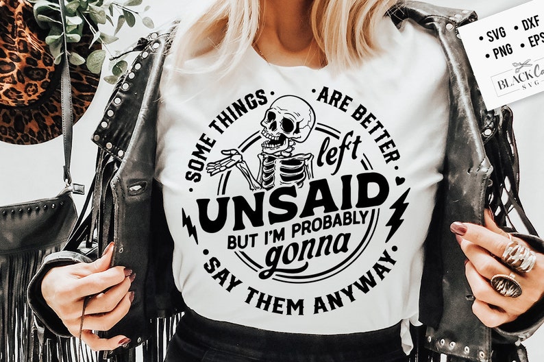 May include: A white t-shirt with a black and white graphic design featuring a skeleton with the text "Some things are better left unsaid, but I'm probably gonna say them anyway."