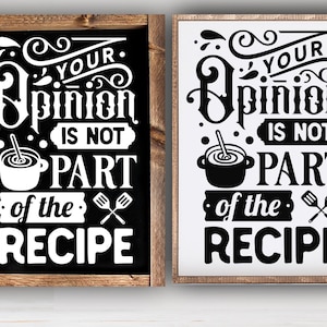 May include: Two black and white signs with the text "Your Opinion Is Not Part Of The Recipe" in a decorative font. The signs are framed in wood and have a rustic look.