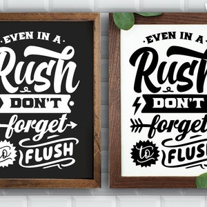 May include: Two black framed signs with white text that reads "Even in a rush, don't forget to flush".