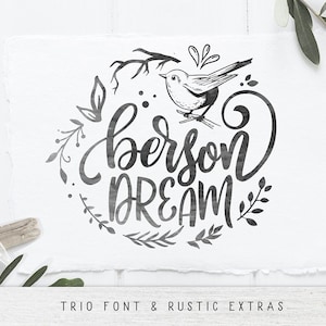 May include: Black and white illustration of a bird with a floral wreath around it. The text "be a person dream" is written in a cursive font inside the wreath.