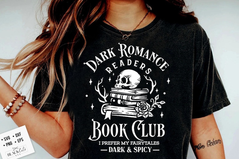 May include: A black t-shirt with a white graphic design that says "Dark Romance Readers Book Club" with a skull and stack of books. The text below the graphic says "I prefer my fairytales - dark & spicy -"