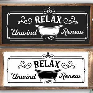 Puede incluir: Dos letreros de madera con el texto "RELAX Desconecta Renueva" y un gráfico de bañera. El letrero superior tiene una bañera blanca sobre un fondo negro. El letrero inferior tiene una bañera negra sobre un fondo blanco.