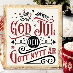 May include: A white wooden sign with black and red lettering that reads "God Jul och Gott Nytt År". The sign is decorated with a snowflake, bells, and a sprig of holly.