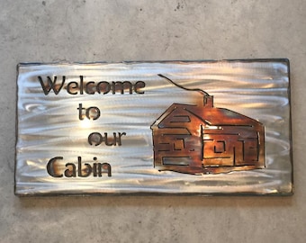 Bienvenido a nuestro letrero de metal Cabin Sign touch coloreado letrero de cabina