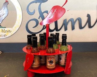 Hot sauce display stand holds 12 bottles of hot sauce with chili peppers made out of steel hot sauce caddy